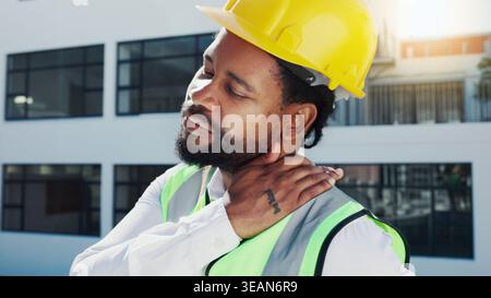 Black man, architect and neck pain with injury in city for stress, discomfort or accident. Male person, civil engineer or contractor with sore Stock Photo