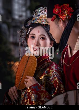 Chinese woman and man dressed in imperial‑era clothing, Chongqing, China Stock Photo