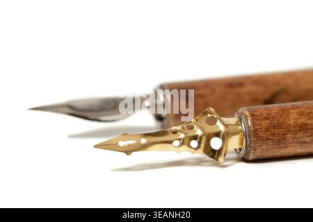 Two vintage calligraphy dip pens on a clean white background with copy space Stock Photo