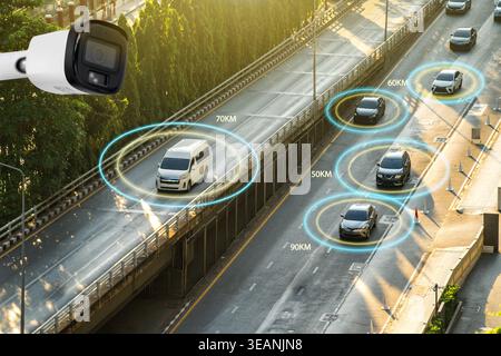 Speed camera surveillance system detecting vehicles on highway road with tracking boxes and speed data overlay Stock Photo