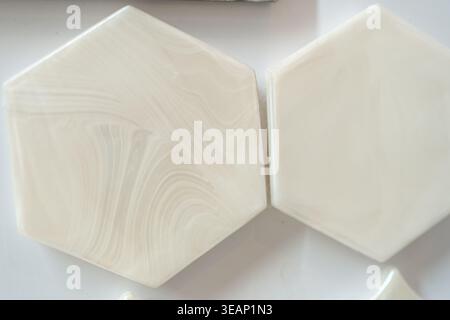 Close-up of white hexagon ceramic tiles. Modern geometric pattern for interior design. Stock Photo