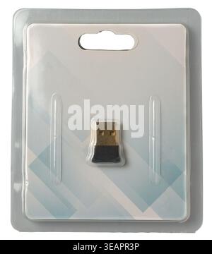 black wireless usb adapter in clear plastic retail blister pack isolated white background, electronic device with gold connector, top view mock-up Stock Photo