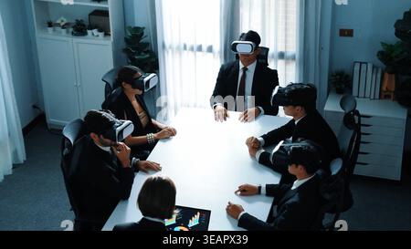 Top view of project manager working on laptop and sending data analysis to business people by using VR glass headset. Professional marketing team Stock Photo