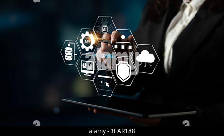 Business Professional Interacting with Digital Interface Featuring Technology Icons for API, Data, Coding, and Cloud Solutions Quark. Stock Photo