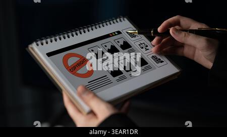 A creative visual representation of copyright protection featuring hands holding a notepad with image thumbnails and legal symbols, showcasing the Stock Photo