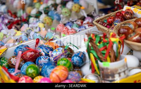 Decorations for sale, showing traditional Czech Easter eggs and braided whips at Na Prikope Stock Photo
