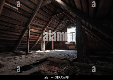 Dusty Rafters hole in wooden floorboards Stock Photo - Alamy