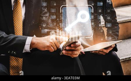 Digital security concept with businessmen holding devices while a virtual key symbol appears above them, representing data protection and Stock Photo