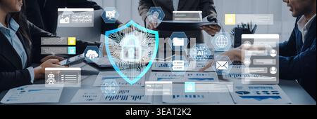 A business team collaborates on cybersecurity solutions, showcasing digital data protection elements in a modern workspace, emphasizing teamwork and Stock Photo