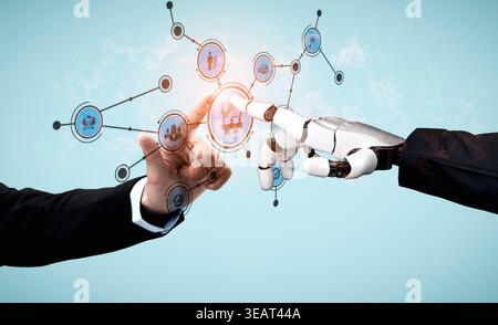 A human hand reaches toward a robot hand, symbolizing the collaboration between technology and people. The background features digital elements Stock Photo
