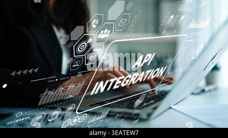 Professional Woman Working on Laptop with API Integration Concept in Modern Office Environment and Digital Interface Graphics. Asymptotic smart data Stock Photo