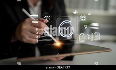 Concept of time management and productivity. Using tools like calendars and checklists to schedule tasks, set goals, and meet project deadlines for Stock Photo