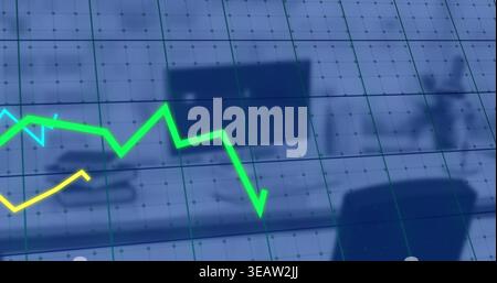Displaying neon-green zigzag line graph across workstation overlay, showing yellow line and grid Stock Photo