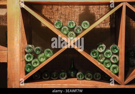 The bottles are green and are arranged in a way that they are all facing the same direction," Stock Photo