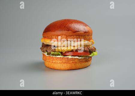 Delicious beef sandwich featuring melted cheddar and crispy grill marks Stock Photo