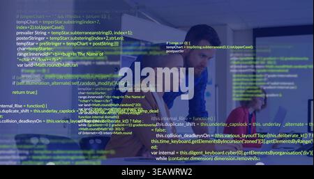 Collaborating three colleagues leaning over laptop at office desk, showing red top and code overlay Stock Photo