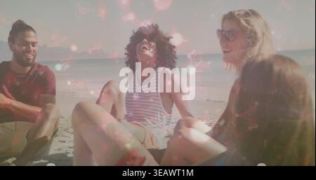 Laughing four friends leaning back and chatting on beach, wearing sunglasses, tank top and shorts Stock Photo