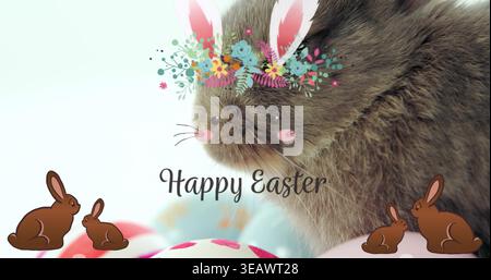 Showing grey pet wearing floral crown and bunny ear overlays in pastel backdrop, with Easter eggs Stock Photo