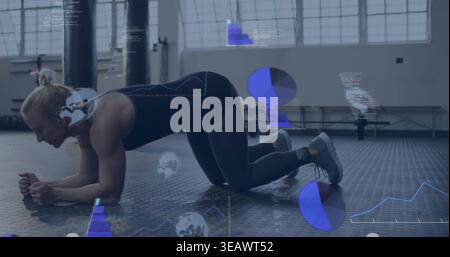 Doing mid-adult woman holding plank on rubber floor at gym, wearing black sportswear, AR graphics Stock Photo