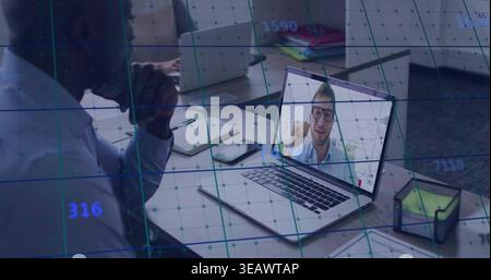 Showing laptop with remote on screen at shared desk, man leaning in business shirt, data grid Stock Photo