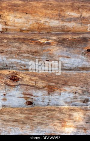A close view of weathered kelohonka logs showing natural grain, aged surfaces and rustic Nordic character. The organic texture and varied tones make t Stock Photo