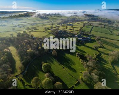 Flintshire, Wales. UK Weather: 24 April 2026, Temperatures are to get in the early 20 degrees centigrade for many today including areas of North Wales. Morning mist starting to burn the away near the village of Lixwm with the Clwydian Range hills in the distance, Flintshire, North Wales.  ©DGDImages/Alamy Live News Stock Photo
