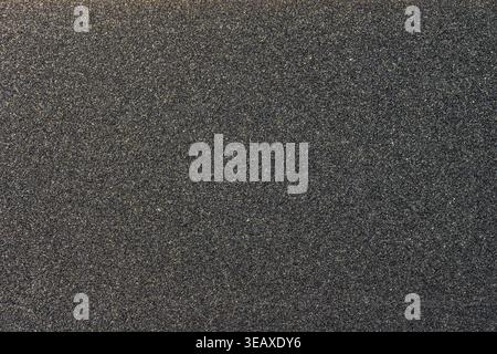 Close-up of a sheet of black sandpaper with P80 grit Stock Photo