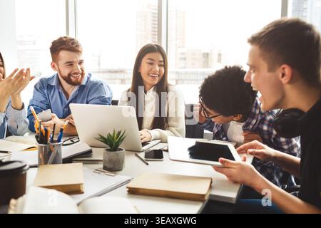 Engaging Group Discussion During a Collaborative Work Session in a Bright Office Space Stock Photo