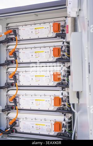 Open control cabinet with several battery modules and cabling, Goodwe battery energy storage on a farm, Moensheim, Germany Stock Photo