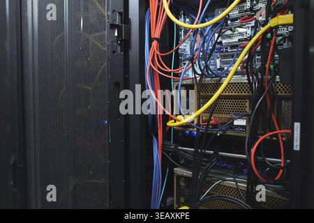 Hardware, wiring and computing equipment in server room for database storage, cybersecurity or power. IT system, rack or cables in data center for Stock Photo