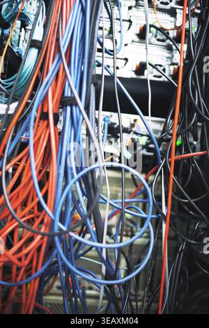 Rack, cables or hardware equipment in server room for database storage, cloud computing or tech. IT infrastructure, closeup or wiring in data center Stock Photo