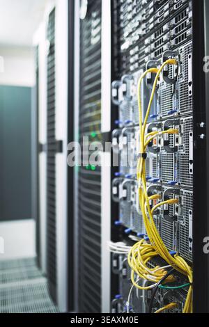 Empty, cables and hardware equipment in server room for database storage, cloud computing or tech. IT infrastructure, rack and wiring in data center Stock Photo