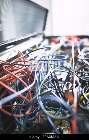 Rack, cables or hardware equipment in server room for database storage, cloud computing or tech. IT infrastructure, closeup and wiring in data center Stock Photo