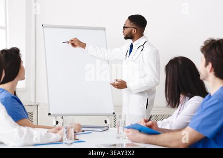 Weekly Meeting. Team Of Doctors Having Brainstorming Session Stock Photo