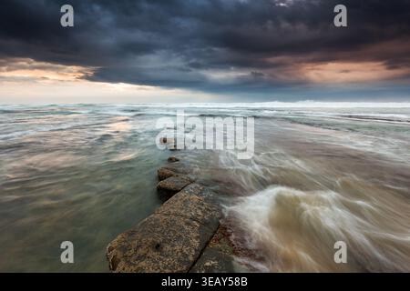 Dramatic Beach Landscape with Stormy Sky Stock Photo