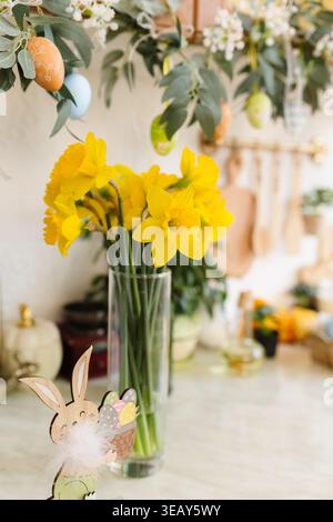 Easter table with traditional cake and cute chicks, spring Stock Photo