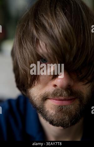 Close-up portrait of bearded man with hair over face, Bali Stock Photo