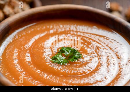 Winter warm soup in a wooden bowl Stock Photo