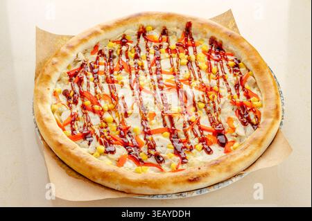 pizza with chicken, corn, and teriyaki sauce Stock Photo