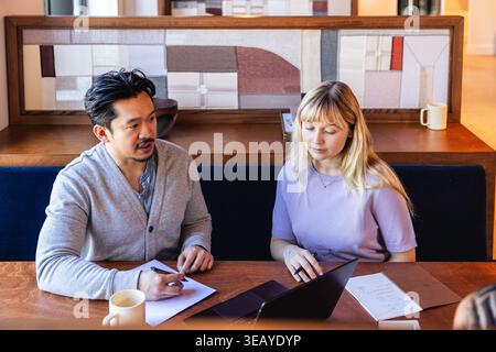 Young Creative Team working together at an office meeting Stock Photo