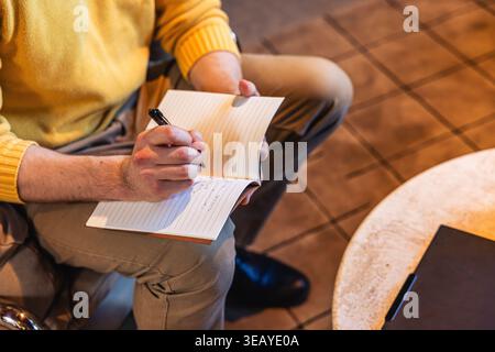 Businessman writing in a notebook Stock Photo