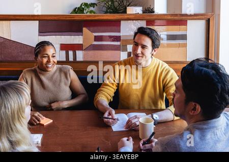 Young Office Team Collaborating in Modern Environment Stock Photo