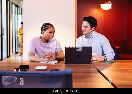 Coworkers having a meeting at the office Stock Photo