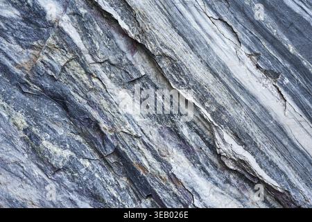 Uneven texture of real marble, background with natural pattern. Stone surface element for design project or backdrop application Stock Photo