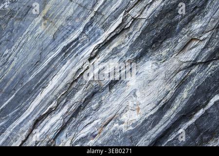 Uneven texture of real marble, background with natural gray white and blue colors, stone surface detail for product display Stock Photo