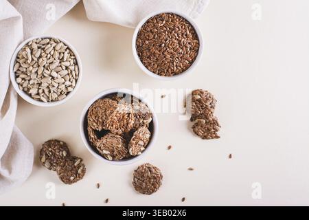Crispy baked bread from flax and sunflower seeds in a bowl on the table top view Stock Photo