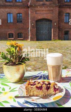 Coffee and cake in the Kulturhof Uckermark cafe in a historic tobacco warehouse in Vierraden, Schwedt an der Oder, Uckermark, Brandenburg, Germany Stock Photo