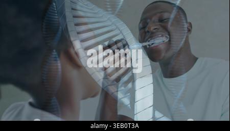 Brushing man and child smiling in bathroom mirror, holding toothbrushes with foam and slat overlay Stock Photo