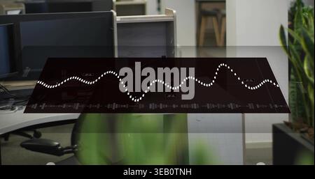 Displaying translucent digital panel floating over open-plan office with dotted waveform, monitors Stock Photo