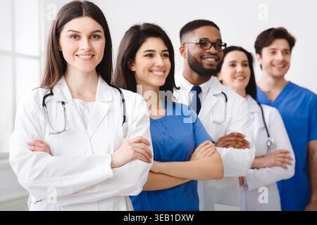 Tem of Confident Doctors And Interns Standing In Hospital Stock Photo